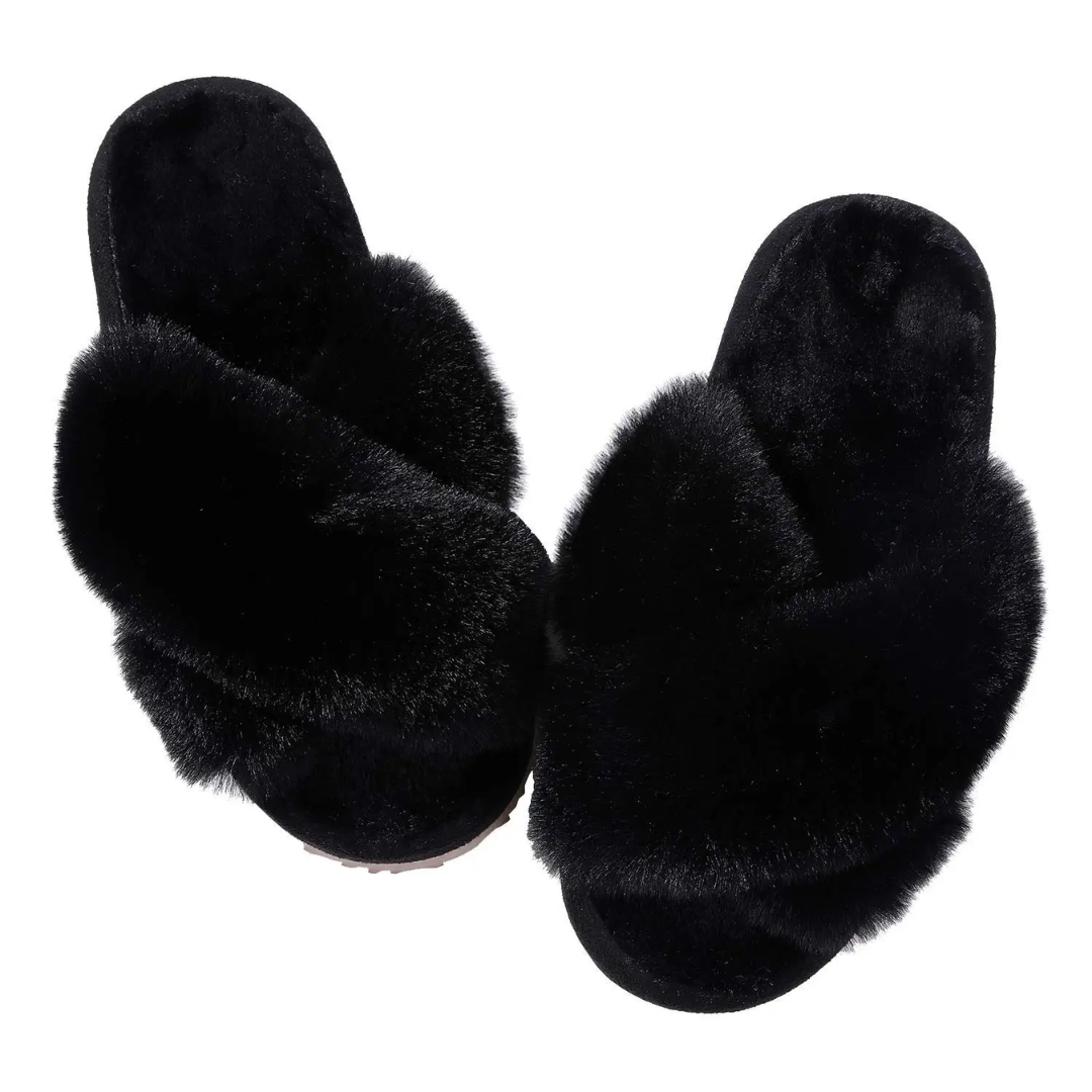 a pair of black slippers on a white background