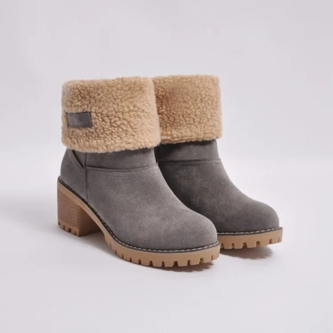 a pair of grey boots with a furry lining