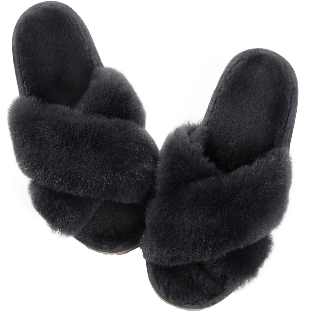 a pair of black slippers with fur on them