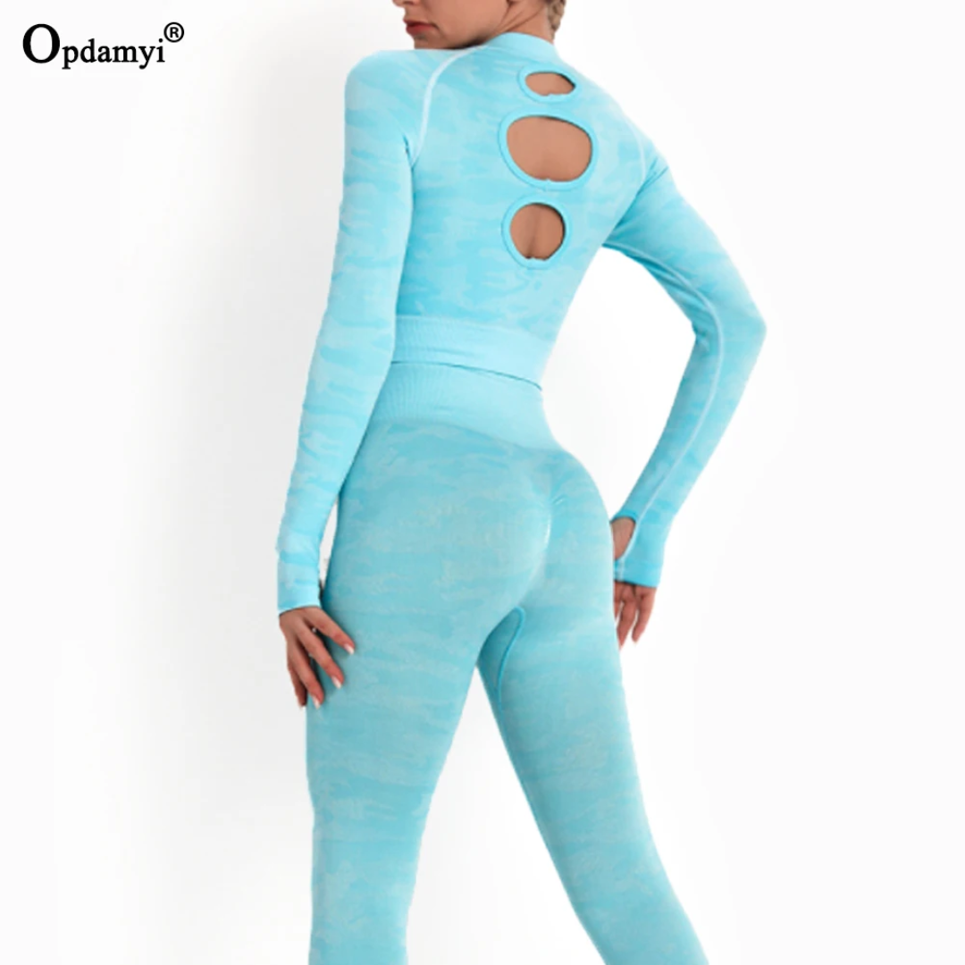 a woman in a blue bodysuit with holes on her back