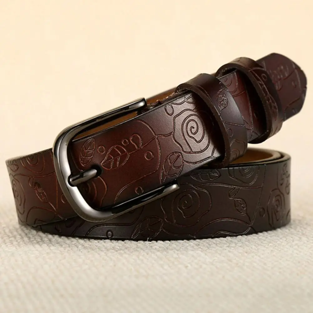 a brown belt with a metal buckle on it