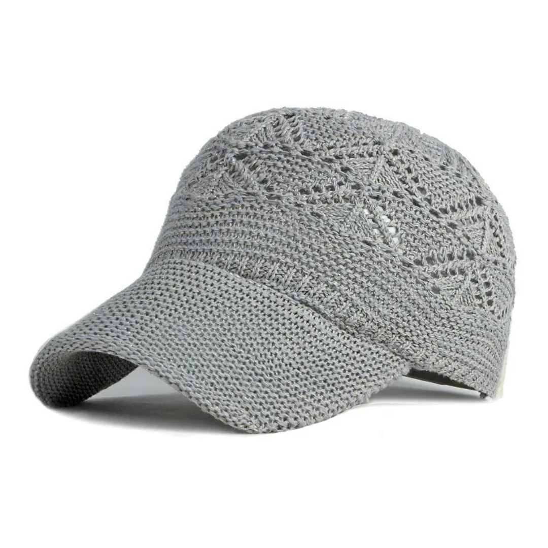 a gray hat with a crochet pattern on it