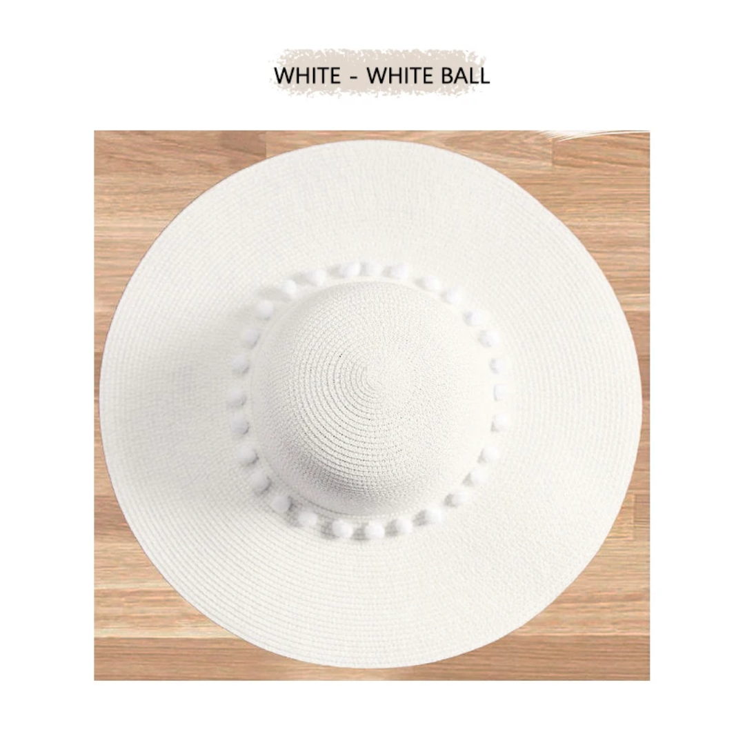 a white hat sitting on top of a wooden table