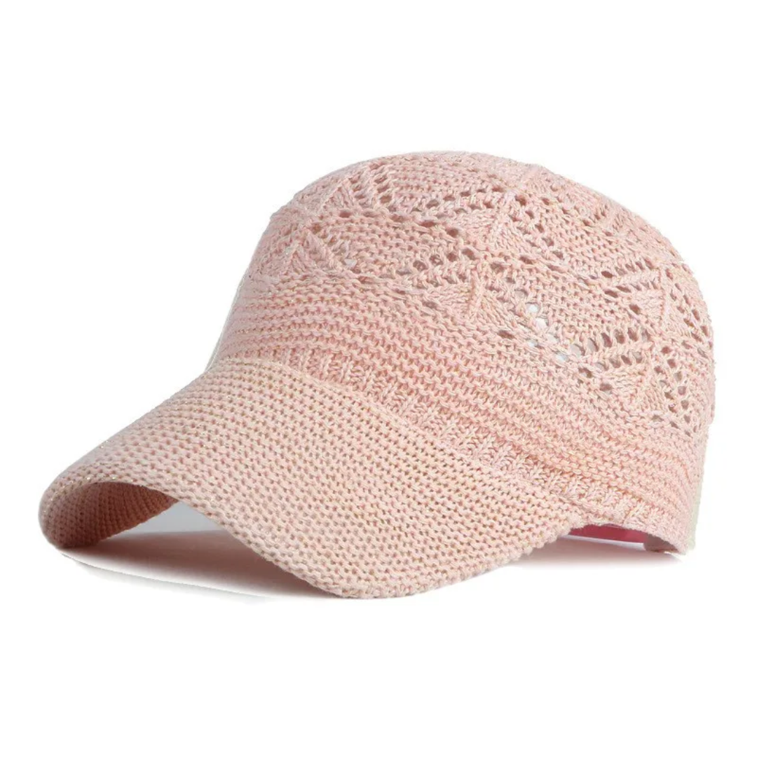 a pink hat with a crochet pattern on it
