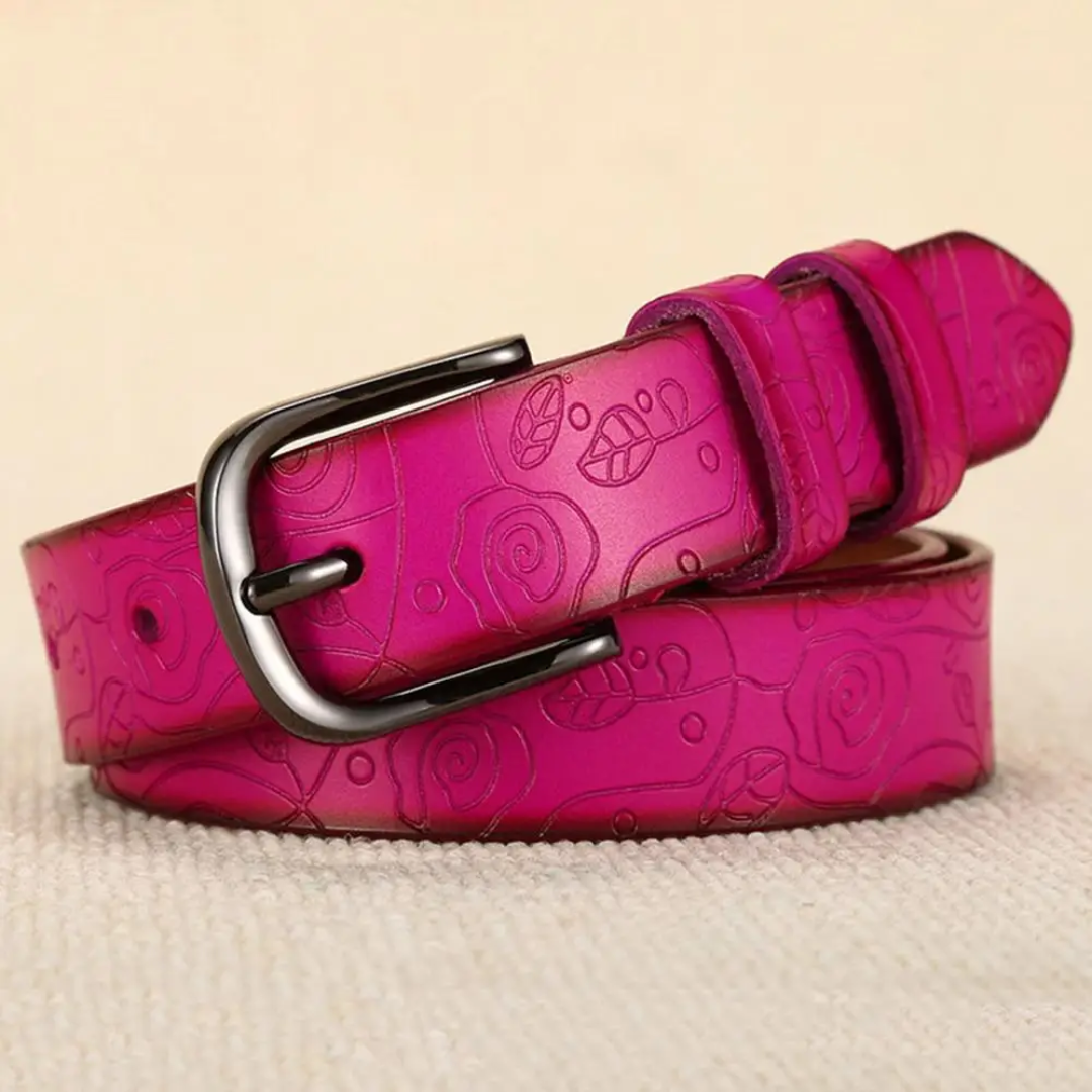 a pink belt with a flower design on it