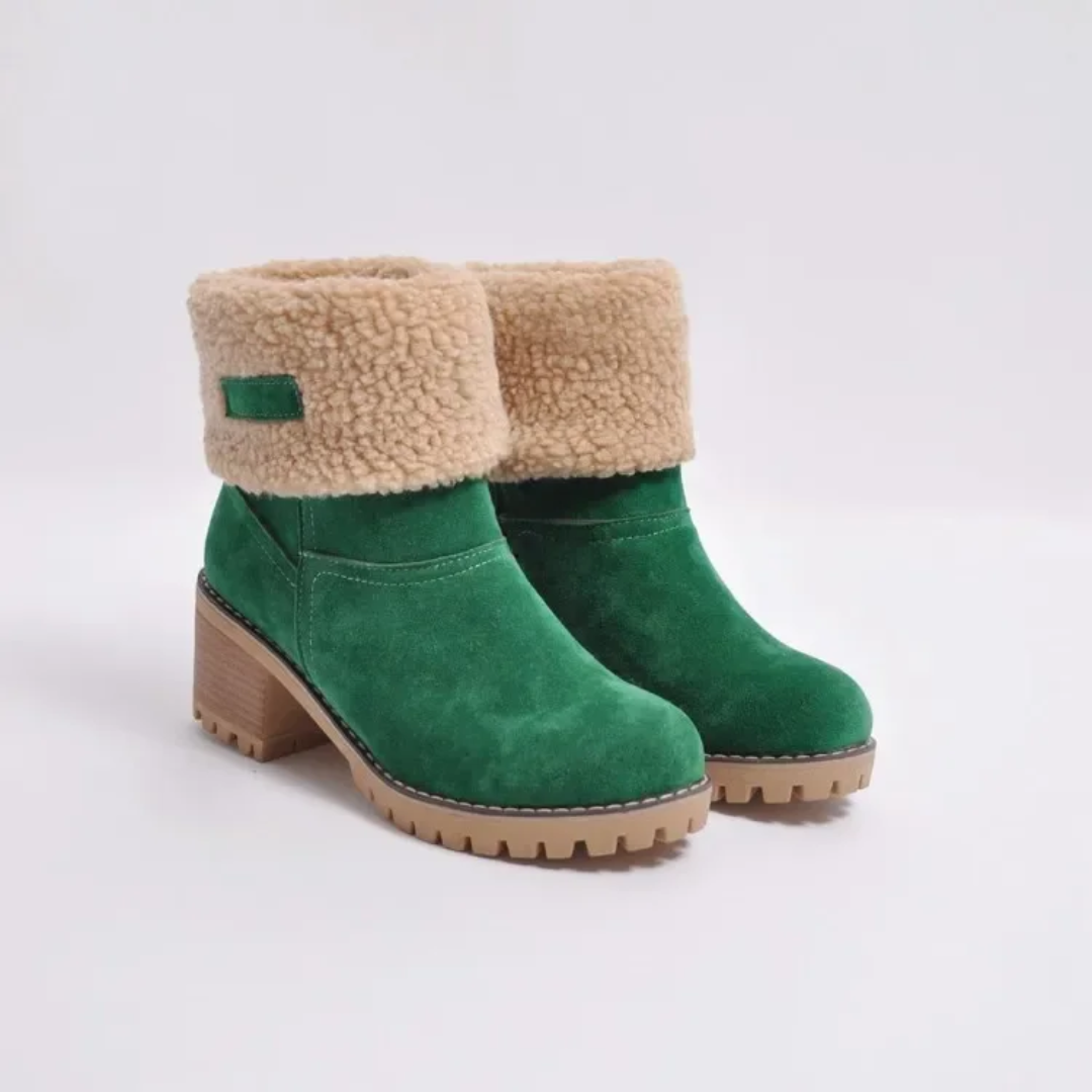 a pair of green boots with a fur lined heel