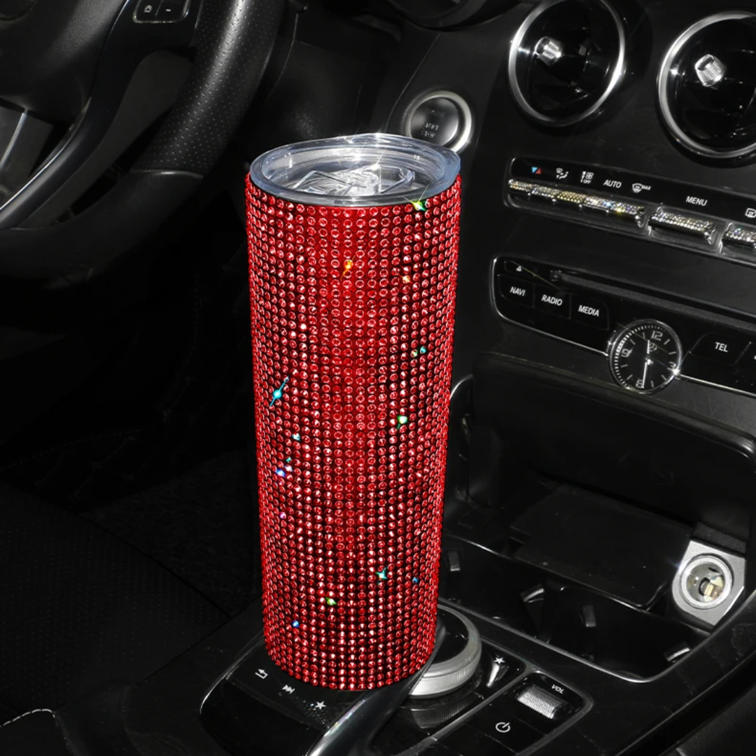 a red speaker sitting on top of a car dashboard