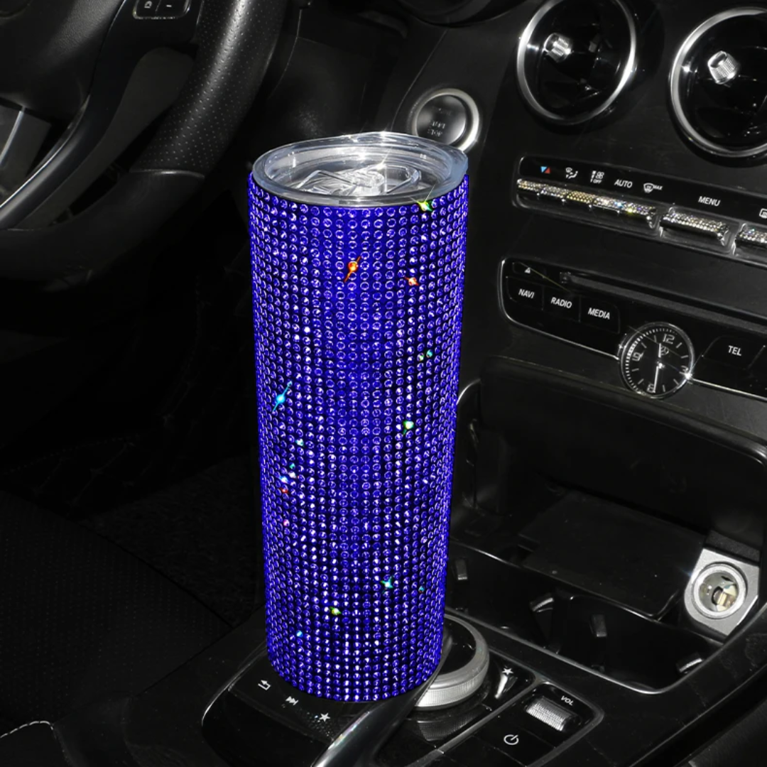 a blue speaker sitting on top of a car dashboard