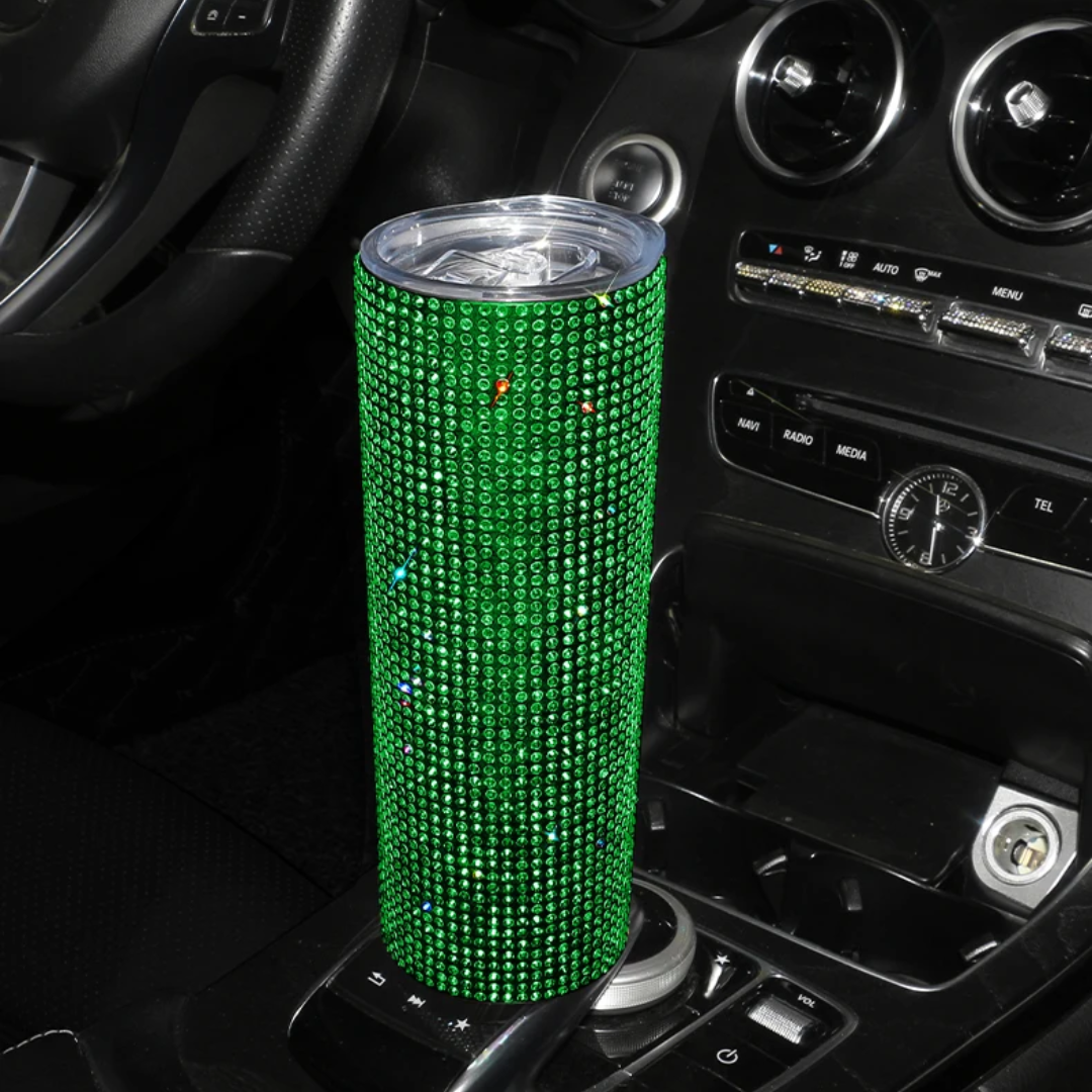 a car dashboard with a can of soda in the center of it