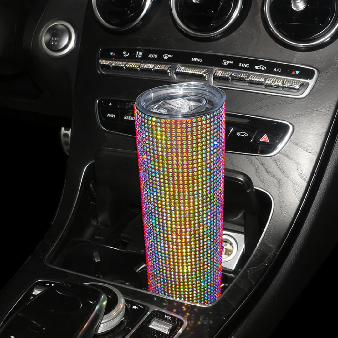 a car dashboard with a cup holder in the center